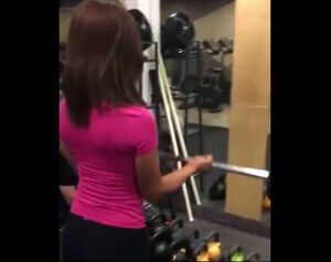 Chesty Korean female exercise her biceps in the gym