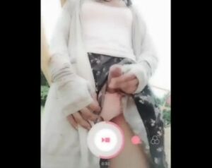 Adorable Chinese she-male in a public playground being sissy