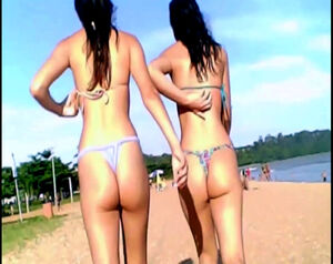 2 suntanned black-haired virgins in panty bathing suit on